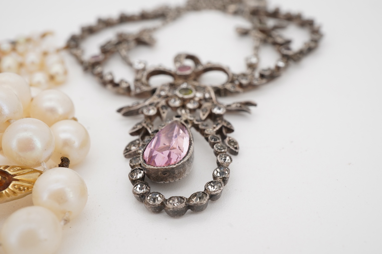 An early 20th century French white metal and three colour paste set drop pendant necklace, 46cm, together with two cultured pearl necklaces, both with 9ct clasps, both approx. 44cm, one a.f.